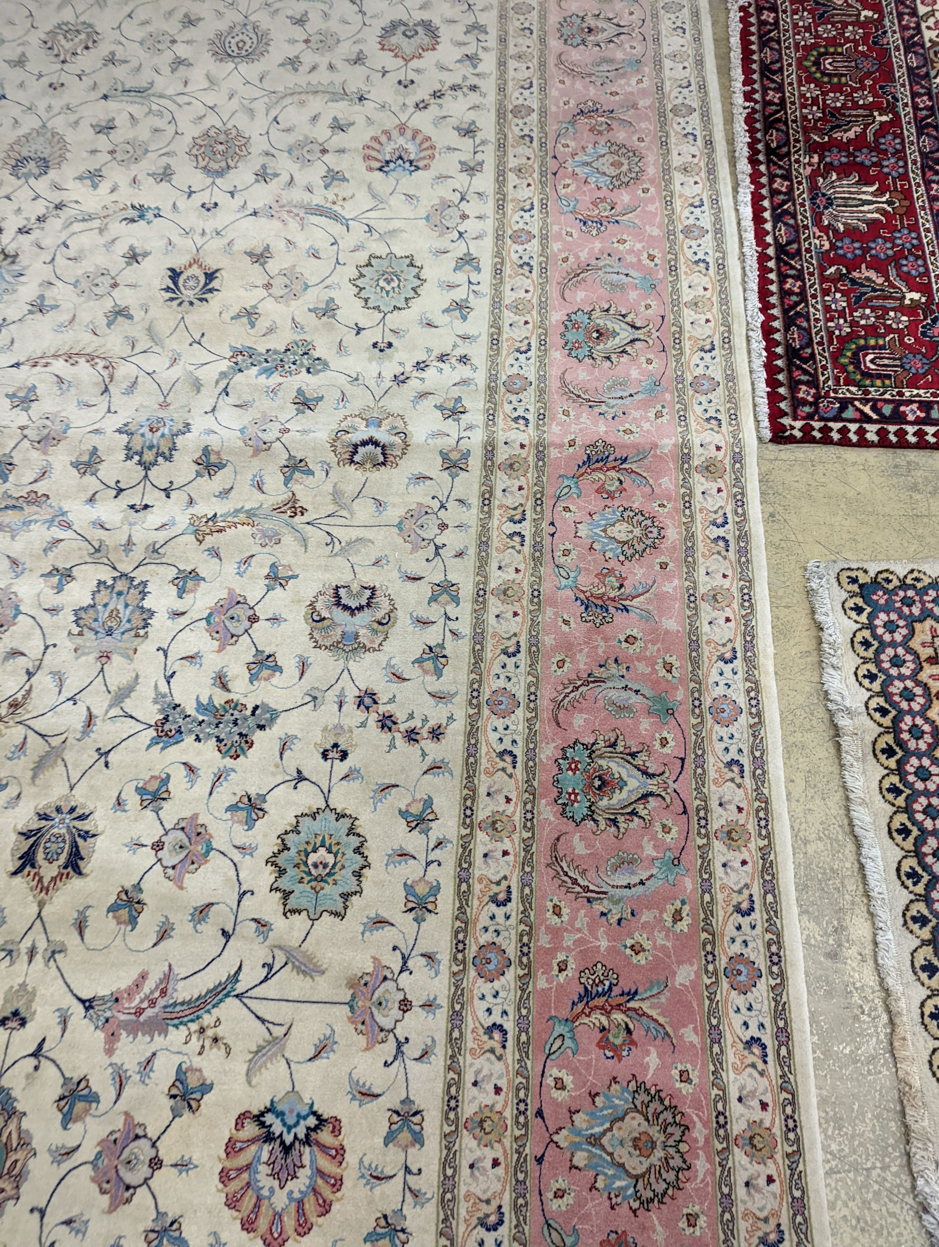 A Persian Tabriz ivory ground carpet, 410 x 300